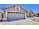 Attached two-car garage is part of this charming single-story home with desert landscaping at 723 S Weaver Dr, Apache Junction, AZ 85120