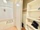 Hallway closet featuring plenty of built in shelves for organized storage space at 723 S Weaver Dr, Apache Junction, AZ 85120