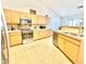 Bright kitchen with light cabinets, stainless steel appliances, and plenty of counter space at 723 S Weaver Dr, Apache Junction, AZ 85120