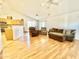 Spacious living room featuring wood floors, bright white walls, and comfortable furniture at 723 S Weaver Dr, Apache Junction, AZ 85120