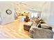 Spacious open layout with a modern kitchen, cozy seating, and natural hardwood flooring at 723 S Weaver Dr, Apache Junction, AZ 85120