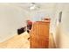 Bright, modern office featuring wood floors, natural light, and a wooden secretary desk at 723 S Weaver Dr, Apache Junction, AZ 85120