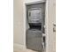 Conveniently located laundry closet featuring a stackable washer and dryer at 7272 E Gainey Ranch Rd # 117, Scottsdale, AZ 85258
