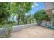 Private patio featuring lush landscaping, a water fountain, and a serene outdoor space at 7272 E Gainey Ranch Rd # 117, Scottsdale, AZ 85258
