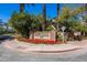 Attractive community entrance sign for The Pavilions with manicured flowers, trees, and landscaping at 7272 E Gainey Ranch Rd # 117, Scottsdale, AZ 85258