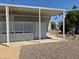 Enclosed exterior space with storage and utility connections, providing functional outdoor solutions at 7300 N 51St Ave # G102, Glendale, AZ 85301