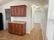 A well-lit kitchen area with granite countertops and wood finish cabinets at 7300 N 51St Ave # G102, Glendale, AZ 85301