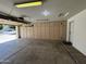 Attached garage featuring built-in cabinets, a functional space for storage and parking at 8006 W Gibson Ln, Phoenix, AZ 85043