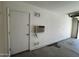 Attached garage featuring air conditioning, electrical outlets, and door to the exterior at 8006 W Gibson Ln, Phoenix, AZ 85043