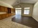 Living area with wood laminate flooring, abundant natural light, and custom cabinetry at 8006 W Gibson Ln, Phoenix, AZ 85043