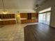 Spacious living room with lots of cabinet space and access to the patio at 8006 W Gibson Ln, Phoenix, AZ 85043