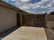 The side yard features a secure privacy gate made of metal and wood at 8006 W Gibson Ln, Phoenix, AZ 85043