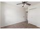 Bedroom with ceiling fan, carpet, and closet at 849 N Revere -- # E, Mesa, AZ 85201