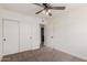 Bedroom with carpet, double closet, and a ceiling fan with lighting at 849 N Revere -- # E, Mesa, AZ 85201