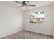 Bedroom featuring ceiling fan, carpet, and view to the outside at 849 N Revere -- # E, Mesa, AZ 85201