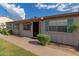 Attractive single-story dwelling highlighted by blue shutters, manicured bushes, and a welcoming entryway at 849 N Revere -- # E, Mesa, AZ 85201