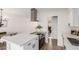 Open-concept kitchen with stainless steel appliances and view into dining and living areas at 849 N Revere -- # E, Mesa, AZ 85201