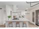 Bright, updated kitchen featuring a modern island with seating and updated appliances at 849 N Revere -- # E, Mesa, AZ 85201