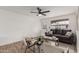 Bright living room with a modern ceiling fan, comfortable seating, and stylish decor at 849 N Revere -- # E, Mesa, AZ 85201