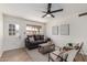 Cozy living area featuring a brown sofa, decorative pillows, and contemporary wall art at 849 N Revere -- # E, Mesa, AZ 85201