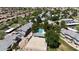 Aerial view showing the neighborhood pool, a basketball court, and tidy townhome community at 860 N Mcqueen Rd # 1058, Chandler, AZ 85225