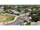 Aerial view of a neighborhood with manicured lawns, landscaped medians, and assigned parking at 860 N Mcqueen Rd # 1058, Chandler, AZ 85225