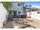 Enclosed backyard with brick patio, outdoor seating, and room for a grill, ideal for entertaining at 860 N Mcqueen Rd # 1058, Chandler, AZ 85225