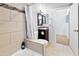 Well-maintained bathroom featuring a bathtub, tile walls, vanity, and efficient layout at 860 N Mcqueen Rd # 1058, Chandler, AZ 85225