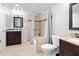Well-lit bathroom with a shower-tub combo, vanity, and tile flooring, creating a cozy atmosphere at 860 N Mcqueen Rd # 1058, Chandler, AZ 85225