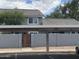 Apartment complex exterior featuring covered parking and gated entrance at 860 N Mcqueen Rd # 1058, Chandler, AZ 85225