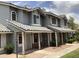 Charming two-story home featuring arched windows, tile roof, and covered entryways for a welcoming curb appeal at 860 N Mcqueen Rd # 1058, Chandler, AZ 85225