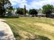 Expansive, manicured lawn with mature trees surrounding the residential area at 860 N Mcqueen Rd # 1058, Chandler, AZ 85225