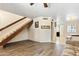 Open-concept living area features wood-look tile floors, a staircase and view to dining room at 860 N Mcqueen Rd # 1058, Chandler, AZ 85225
