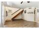 Spacious living room with wooden floors, a staircase, and an entryway with plenty of natural light at 860 N Mcqueen Rd # 1058, Chandler, AZ 85225