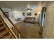 View of a cozy living room with wood floors, a staircase, and a comfortable seating area at 860 N Mcqueen Rd # 1058, Chandler, AZ 85225