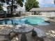Community pool area featuring a picnic table under shady trees at 860 N Mcqueen Rd # 1058, Chandler, AZ 85225