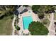 Aerial shot of the community pool showcasing ample seating, a spa, and well-maintained landscaping at 860 N Mcqueen Rd # 1058, Chandler, AZ 85225