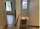 Second story landing featuring hardwood floors and natural light at 860 N Mcqueen Rd # 1058, Chandler, AZ 85225