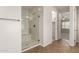 Bright bathroom featuring a glass-enclosed shower with tile surround and neutral colors at 881 E Boston St, Gilbert, AZ 85295