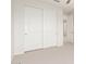 Bright bedroom featuring a closet with sliding doors, neutral carpet, and ceiling fan at 881 E Boston St, Gilbert, AZ 85295
