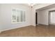 Well-lit dining room with large window and wooden shutters offers an inviting space at 881 E Boston St, Gilbert, AZ 85295