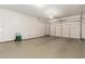 Spacious garage with epoxy flooring and ample storage space at 881 E Boston St, Gilbert, AZ 85295
