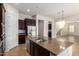 Open concept kitchen featuring a large island, stainless steel appliances, and ample cabinet space at 881 E Boston St, Gilbert, AZ 85295
