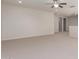 Large open living room features neutral walls, carpet, and ample natural light at 881 E Boston St, Gilbert, AZ 85295