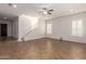 Large open living space with tile floors, staircase, and an abundance of natural light from the windows at 881 E Boston St, Gilbert, AZ 85295