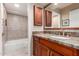 Updated bathroom with granite countertop vanity, tile flooring, and bathtub with shower at 9430 S 47Th Pl, Phoenix, AZ 85044