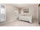 Cozy bedroom with shuttered windows, tiled floors, and floral-patterned daybed at 9430 S 47Th Pl, Phoenix, AZ 85044