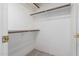 Empty closet featuring two rows of hanging poles and a white interior at 9430 S 47Th Pl, Phoenix, AZ 85044