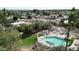 Elevated shot of sparkling community pool in meticulously landscaped community surrounded by mature trees at 9430 S 47Th Pl, Phoenix, AZ 85044