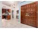 Inviting entryway showcasing double doors, tile flooring, and open access to the kitchen at 9430 S 47Th Pl, Phoenix, AZ 85044